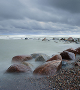 Storm over a rocky beach.